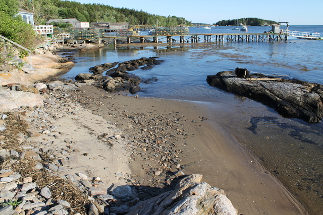 Beach and shoreline in front of cottages